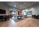 Spacious game room showcasing two pool tables, seating areas, and decorative wall art for entertainment at 10057 Regency Canyon Way, Las Vegas, NV 89148