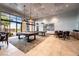 Elegant game room showcasing pool tables, comfortable seating, and expansive windows offering outdoor views at 10057 Regency Canyon Way, Las Vegas, NV 89148