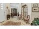 Charming living room features light wood flooring, decoratively displayed artifacts, and soft, natural light at 10057 Regency Canyon Way, Las Vegas, NV 89148