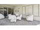 Covered patio with brick flooring, chairs, and a table, perfect for outdoor dining and entertaining at 10057 Regency Canyon Way, Las Vegas, NV 89148