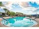 A resort-style pool features a tranquil atmosphere with mature trees, lounge chairs, and stunning views at 10057 Regency Canyon Way, Las Vegas, NV 89148