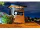 Regency at Summerlin community sign, set amongst landscaped bushes, lit at night at 10057 Regency Canyon Way, Las Vegas, NV 89148