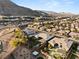 Aerial view of backyard featuring pool, spa, landscaping, outdoor kitchen, and covered patio at 10179 Emerald Sunset Ct, Las Vegas, NV 89148