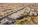 Expansive aerial view of homes showcasing backyard pools and landscaping at 10179 Emerald Sunset Ct, Las Vegas, NV 89148