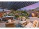 Inviting backyard featuring a spa, pergola, and serene water fountain at 10179 Emerald Sunset Ct, Las Vegas, NV 89148