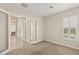 Bedroom with carpet floors, base molding, and french doors with access to the house at 10179 Emerald Sunset Ct, Las Vegas, NV 89148
