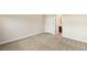 Spacious bedroom with neutral carpet, base molding and an ensuite bathroom at 10179 Emerald Sunset Ct, Las Vegas, NV 89148