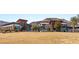 Exterior view of the community clubhouse with expansive lawn and mountain views at 10179 Emerald Sunset Ct, Las Vegas, NV 89148