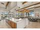 Well-equipped clubhouse kitchen with a large island and plenty of natural light at 10179 Emerald Sunset Ct, Las Vegas, NV 89148