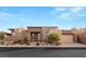 Contemporary home featuring a well-manicured front yard and neutral color scheme at 10179 Emerald Sunset Ct, Las Vegas, NV 89148