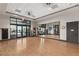 Large fitness studio with wood floors, mirrors, and exercise equipment for a complete workout at 10179 Emerald Sunset Ct, Las Vegas, NV 89148