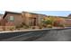 Inviting single-story home featuring a low-maintenance front yard and brick accents at 10179 Emerald Sunset Ct, Las Vegas, NV 89148