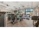 Bright community gym featuring modern exercise equipment, large windows, and mounted TVs at 10179 Emerald Sunset Ct, Las Vegas, NV 89148