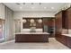 Elegant kitchen with granite counters, stylish lighting, and stainless steel appliances at 10179 Emerald Sunset Ct, Las Vegas, NV 89148