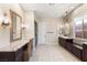 Spacious main bathroom boasts dual vanities, granite counters, and a glass-enclosed shower at 10179 Emerald Sunset Ct, Las Vegas, NV 89148