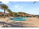 Outdoor pool surrounded by palm trees, offering a resort-style living experience at 10179 Emerald Sunset Ct, Las Vegas, NV 89148