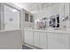 Bright primary bathroom with dual sinks, a large mirror and walk-in shower at 10273 Grecian Laurel Ct, Las Vegas, NV 89183
