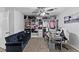 Bright bedroom features a large wardrobe closet system, ceiling fan, comfortable seating and lots of natural light at 10273 Grecian Laurel Ct, Las Vegas, NV 89183