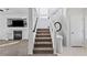 Entryway with staircase featuring new carpet and paint with a view of the Gathering room at 10273 Grecian Laurel Ct, Las Vegas, NV 89183