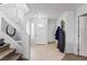 Entryway with tile floors, a coat closet and stairway at 10273 Grecian Laurel Ct, Las Vegas, NV 89183
