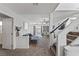 Open concept living room with stairway and backyard access at 10273 Grecian Laurel Ct, Las Vegas, NV 89183