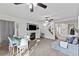 Large living room featuring a fireplace, stairway and dining area at 10273 Grecian Laurel Ct, Las Vegas, NV 89183
