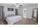 Comfortable main bedroom with plush carpet, neutral walls, and an en-suite bathroom at 10273 Grecian Laurel Ct, Las Vegas, NV 89183