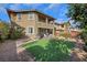 A spacious backyard featuring a artificial lawn, and a covered patio at 10313 Aragon Crown Rd, Las Vegas, NV 89135