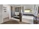 Bright bathroom featuring bathtub, shower, and stylish fixtures at 10313 Aragon Crown Rd, Las Vegas, NV 89135