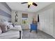 Charming bedroom features striped walls, a cozy daybed, and a comfortable seating area at 10313 Aragon Crown Rd, Las Vegas, NV 89135