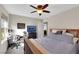 Bedroom showcases a ceiling fan, study desk, and media center for entertainment at 10313 Aragon Crown Rd, Las Vegas, NV 89135