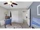 Well-lit bedroom featuring stylish decor, a closet, and a seating area at 10313 Aragon Crown Rd, Las Vegas, NV 89135