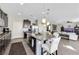Open kitchen featuring an island with bar seating, stainless appliances, and breakfast nook at 10313 Aragon Crown Rd, Las Vegas, NV 89135