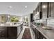 Modern kitchen with granite countertops, stainless steel appliances, and a center island at 10313 Aragon Crown Rd, Las Vegas, NV 89135