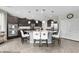 Modern kitchen boasts a large island with seating and stainless steel appliances at 10313 Aragon Crown Rd, Las Vegas, NV 89135