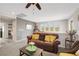 Upstairs living room is open and bright, featuring a comfortable sofa and scenic views at 10313 Aragon Crown Rd, Las Vegas, NV 89135