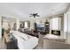 Comfortable living room boasts a ceiling fan, fireplace, and stylish furnishings for cozy relaxation at 10313 Aragon Crown Rd, Las Vegas, NV 89135