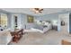 Spacious main bedroom with blue walls, ensuite bathroom, and walk-in closet at 10313 Aragon Crown Rd, Las Vegas, NV 89135