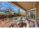 Covered patio with seating area offers relaxation and outdoor dining options at 10313 Aragon Crown Rd, Las Vegas, NV 89135