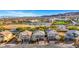 Beautiful street view of homes, manicured lawns and desert landscaping in a peaceful residential neighborhood at 10313 Aragon Crown Rd, Las Vegas, NV 89135