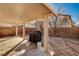 Well-maintained backyard with a covered patio and BBQ at 11147 Verismo St, Las Vegas, NV 89141