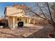 Scenic view of the backyard featuring a covered patio and drought-tolerant landscaping at 11147 Verismo St, Las Vegas, NV 89141