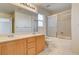 Bathroom featuring double sinks, tile floor, and glass-enclosed shower at 11147 Verismo St, Las Vegas, NV 89141