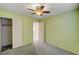 Comfortable bedroom with closet, ceiling fan, and pleasant green walls at 11147 Verismo St, Las Vegas, NV 89141