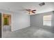 Bedroom with carpeted floor, ceiling fan, and natural light at 11147 Verismo St, Las Vegas, NV 89141