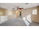 Spacious bonus room with ceiling fan and carpeted floors at 11147 Verismo St, Las Vegas, NV 89141