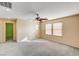 Large carpeted bonus room with ceiling fan and natural light at 11147 Verismo St, Las Vegas, NV 89141