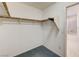 Walk-in closet with clothes rods and access to the bathroom at 11147 Verismo St, Las Vegas, NV 89141