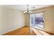 Bright dining space with hardwood flooring and a glass sliding door to the backyard at 11147 Verismo St, Las Vegas, NV 89141