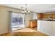 Dining area features hardwood floors, backyard access, and overlooks the kitchen at 11147 Verismo St, Las Vegas, NV 89141